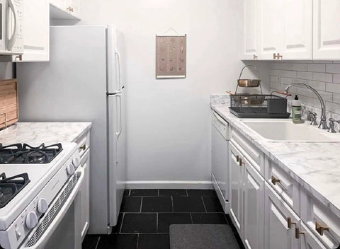 Peel And Stick White Marble Vinyl Countertop Backsplash Wrap 36 By 180 Inches Waterproof Self Adhesive Contact Paper Removable Laminate Wallpaper For Kitchen Reno And Bath Decor installed on kitchen counters and backsplash, showing white marble design and fit in a modern kitchen setting.
