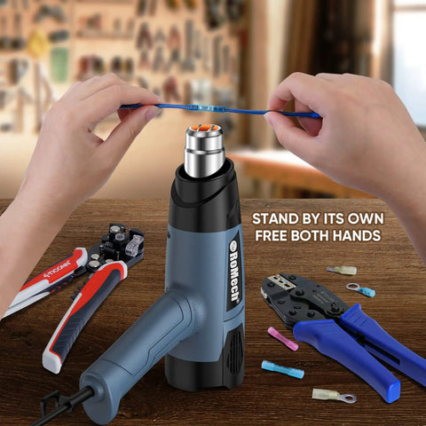Beast 1500W Heat Gun Kit With Variable Temperature Control And Twin Airflow Settings Hot Air Gun For Crafts And Shrink Wrap 120F To 1200F Range Includes 4 Nozzles Blue in use on a workbench with tools.