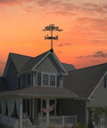 Black Metal Pickup Truck Weathervane Ornament on house roof at sunset, outdoor yard decor wind direction indicator iron craft.