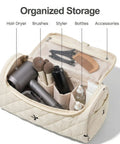 Open quilted hair tools travel bag with hanging hook showing hair dryer, brushes, and styling accessories neatly organized