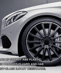 Premium 4 Pack Wheel Center Caps For Cars Trucks And Suv Snap In Rim Hub Covers Waterproof Rust Resistant Decoration Upgrades Your Ride With Sleek Black Finish Badass Protection For Every Vehicle And Tight Fit Guarantee on a stylish silver vehicle wheel.
