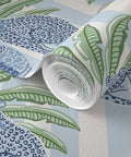 Top Shelf PVC Free Preppy Wallpaper With Heavy Duty Matte Linen Texture Ideal For Busy Homes Or Tight Offices close-up of rolled wallpaper with blue and green leaf design