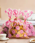 Clear Treat Bags With Twist Ties 5x9 Inches 100 Pack Happy Face Print Party Fav Bags For Candy Snacks Gifts Events And Celebrations Thick Leak Resistant Goodie Bags filled with cookies on a table