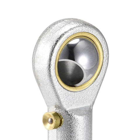 Two Pack One Quarter Inch Rod End Bearings With Pre Lubricated 28 TPI Right Hand Female Thread, 13 Degree Misalignment, Spherical Steel Body, Hardened Ball, Beefy Yet Precise, 7.7 kN Static And 4.5 kN Dynamic Load Capacity. Close-up of a 1/4 inch steel rod end bearing with brass insert.