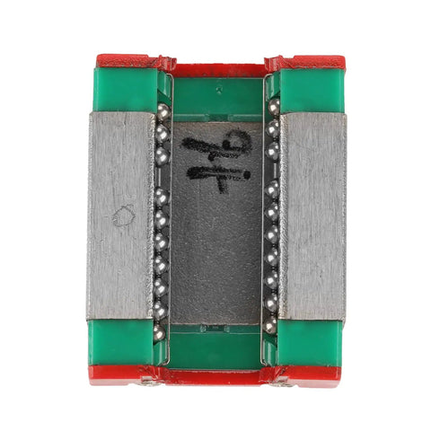 Close-up of Compact Miniature Linear Rail Guide with 12mm width, metal and plastic construction, view of the ball bearing system