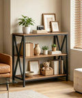 Game Changer Three Tier Industrial Console Table With Real Deal Storage Shelves Narrow Sofa Table For Entryway Foyer Living Room Decor Built Tough Rustic Brown Wood And Black Metal Frame with decorative items and plants.