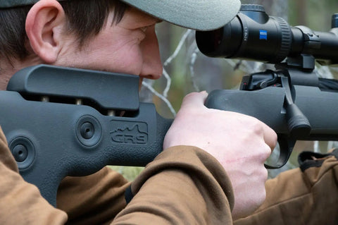 Fenris Tikka CTR Grey Stock With Reinforced Fiberglass in use, showing adjustable cheek piece and ergonomic design.