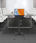 Premium Adjustable Height Standing Desk With Smooth Foot Pedal Operation And Fully Rolling Ergonomic Office Station in office setting.