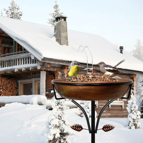 Vintage Outdoor Metal Bird Bath With Free Standing Stake And Detachable Feeder Bowl In Antique Bronze Finish in snowy yard