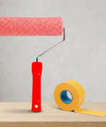 Slick Wall Texture Roller For Interior Painting With Adhesive Masking Paper Heavy Duty Build, red handle with pink roller.