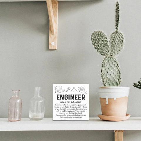 Engineer Decor Wooden Box Sign For Home Office Shelf Or Table Nerdy Yet Cool Gift next to cactus and bottles on shelf.