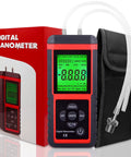 Digital manometer handheld HVAC air pressure meter with dual ports, red/black body, green backlit display, tubing and carrying pouch.