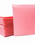 Pink Poly Bubble Mailers 3.5 By 5 Inch Small Padded Envelopes, stack of 50, self-sealing shipping bags for lightweight protective packaging.