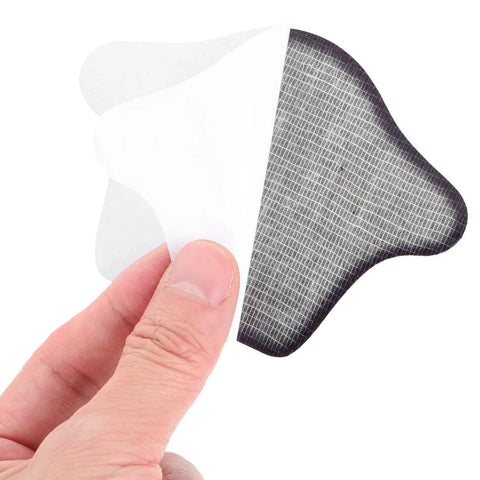 Premium Heel Grips Insert Kit Locks Your Shoes In Place Zero Wiggle Room Foam Heel Pads shown in hand with adhesive backing.
