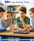 Children observing Newtons Cradle Desk Toy With 7 Beads Kinetic Pendulum for stress relief and visual gravity demonstration.