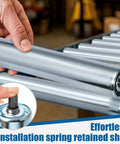 Hand installing Beefy Heavy Duty Conveyor Replacement Rollers 1.9 Inch Diameter 21 Inch Between Frames Galvanized Steel 6 Pack