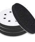 Close-up of Mkobon 4-pack 5-inch 8-hole foam sanding pads with black abrasive surface and white foam backing