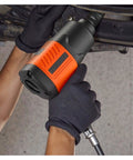 Professional Grade Badass 1/2 Inch Drive Air Impact Wrench with 1100 Ft Lbs Knockout Torque being used under a vehicle.