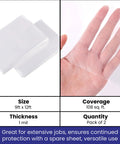 2 Pack Heavy Duty Plastic Drop Cloth 9x12 Feet Waterproof Clear Tarp shown on hand illustrating thinness and flexibility