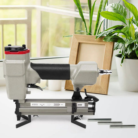 Pneumatic Picture Frame Nailer One Quarter Inch to Five Eighths Inch V Nailer for Wood Frames shown near a window.