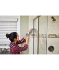 Person applying Advanced Silicone Kitchen And Bath Sealant In Almond Color For Easy DIY No Mess Caulking in a bathroom