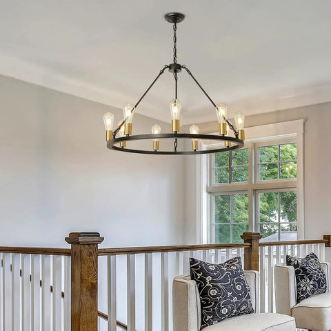 Black And Gold 9 Light Industrial Wagon Wheel Farmhouse Chandelier, 32 Inch Diameter, hanging in elegant living room.