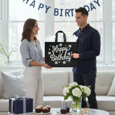 Man and woman holding 2 Pack 13 Inch Large Birthday Gift Bags With Tissue Paper And Cards, Reusable Nonwoven Gift Bags With Handles