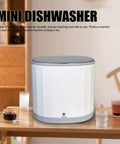 Tiny But Mighty Portable Mini Dishwasher With 360 Degree Directional Spray And Usb Battery For Countertop Scrubbing Plates Bowls And Produce Super Chill For Apartments Camping Rv And Dorms Zero Grease Headaches on wooden table with drinks.