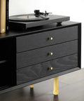 Switch Up Your Setup With These Durable Adjustable Furniture Legs Crafted From Heavy Aluminum Alloy Featuring Quick Height Tweaks On Twist Base Ideal For Beds Couches Cabinets And Shelves Comes In Sweet Gold Sharp Black Or Clean Silver Finishes. View of black dresser with gold adjustable legs and vinyl player.