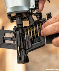 Person loading One And Three Quarters Inch Full Round Head Roofing Nails With Smooth Shank Electro Galvanized Wire Coil into nailer