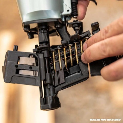 Person loading One And Three Quarters Inch Full Round Head Roofing Nails With Smooth Shank Electro Galvanized Wire Coil into nailer