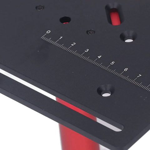 Close-up of Heavy Duty Router Table Featuring Manual Crank Lift System For Dead On Height Adjustments And Flawless Woodworking Cuts Straight Up Shop Classic Gear Black with measurement markings.
