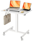 Mobile Standing Desk With Wheels For The Home Office Compact Rolling Workstation With Lockable Front Casters Pneumatic Height Adjustable Laptop Desk White