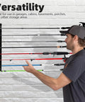 Person arranging rods on Ceiling Mounted Fishing Rod Rack Holder With Soft Protective Pad, Heavy Duty Steel Storage Organizer For Garage Or Basement.