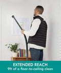 Man using 3 Gallon Bagged Canister Vacuum For Home And Shop Lightweight With Powerful Suction Includes 3 Cleaning Tools