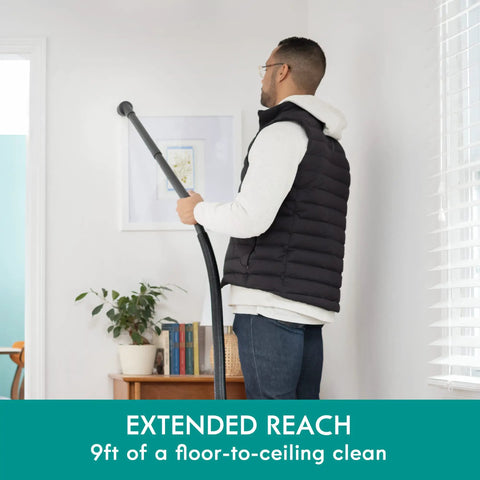 Man using 3 Gallon Bagged Canister Vacuum For Home And Shop Lightweight With Powerful Suction Includes 3 Cleaning Tools