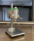Industrial Grade Mini Bench Drill Press With Precision Variable Speed Control, compact aluminum alloy body on a tabletop.