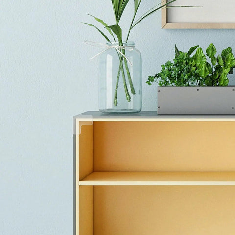 Bookshelf with 16 Pcs PVC Corner Protectors for furniture, clear edge guards installed on top for safety.