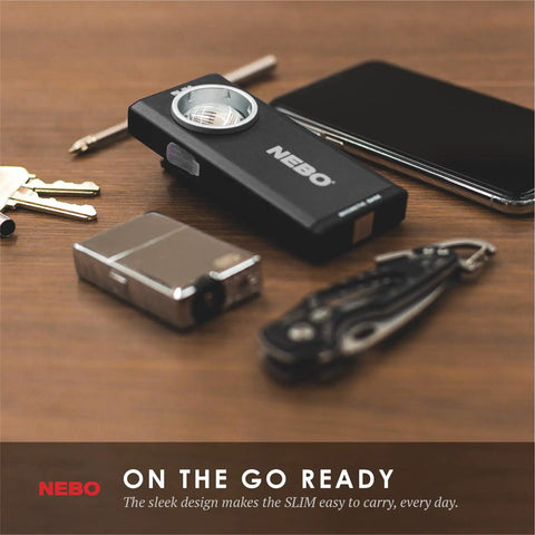 500-Lumen LED COB Work Flashlight With Rechargeable Battery on wooden table, pocket clip, keys, and phone visible