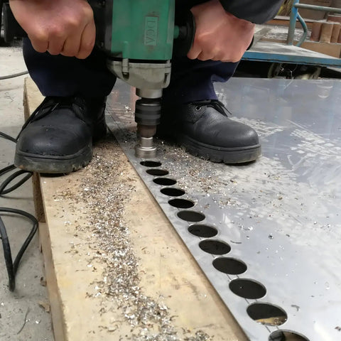 Heavy Duty Carbide Hole Saw Kit For Stainless Steel With 7/8, 1 1/8, And 1 3/8 Inch Diameters, Integrated Pilot Bits in use