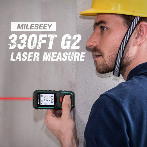 Person using G2 Laser Measuring Tool With Angle Sensor, 330 Ft Range, on a construction site wall
