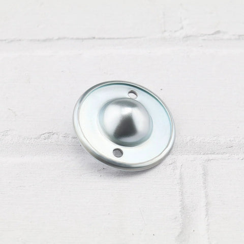 Front view of 12 Pieces Ball Transfer Bearings with nylon balls in carbon steel casing, 45mm diameter, 31mm hole spacing for transmission systems.