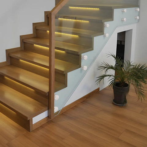10 Pack 304 Stainless Steel Glass Railing Standoffs With Slick Wire Draw Texture installed on a modern wooden staircase.