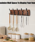 Rustic Wall Mount Coat Rack with Five Triple Hooks organizing kitchen utensils in a farmhouse style setting