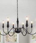 37.4 Inch Black Farmhouse Chandelier with 8 candle style lights, rustic iron arms, hanging in dining room for cozy vibe