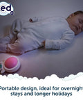 Sleeping baby with Calming Baby Sleep Aid With 6 Soothing Vibration Modes And Red Night Light next to crib.