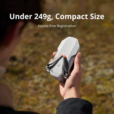 Person holding compact Atom 2 Fly More Drone Combo With RC PTD 1 For Adults 4K Video 8K Photo 10KM Transmission under 249g.
