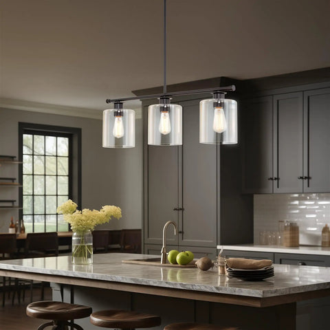 Dope Three Light Modern Industrial Farmhouse Kitchen Island Pendant Lighting With Clear Glass Cylinder Shades shown over island