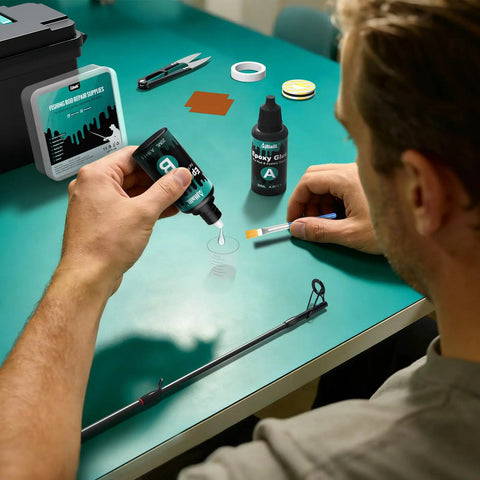 Essential Fishing Rod Repair Kit With Strong Epoxy Glue, user applying glue to fishing rod on green table.