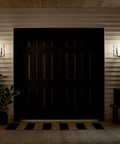 Outdoor Wall Light 1 Light Exterior Wall Sconce With A Slick Black Finish And Satin Etched Opal Glass for porch and walkway lighting.